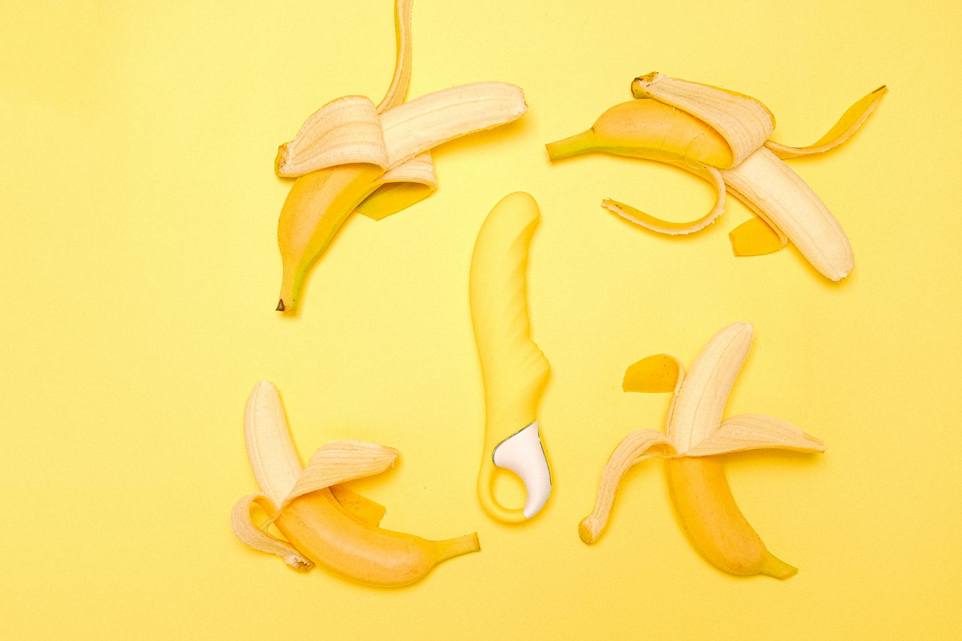 Array of vibrant adult toys including lemon vibrators and accessories in close-up view